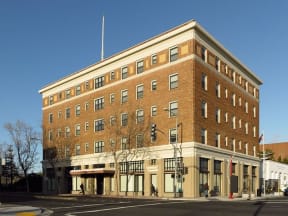 a large brick building on the corner of a street