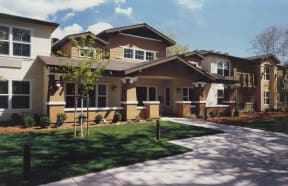 a large house with a sidewalk in front of it
