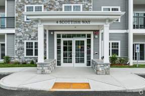 The front of a building with a sign that says "4 Scottish Way".