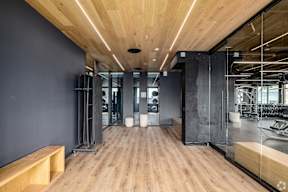 A Gym With Wooden Floors at Hue Soul Apartments, East Orange, NJ, 07018