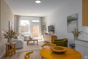 A Living Room With a Yellow Table at Hue Soul Apartments, New Jersey, 07018