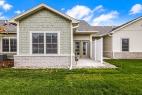 a house with a driveway and a lawn