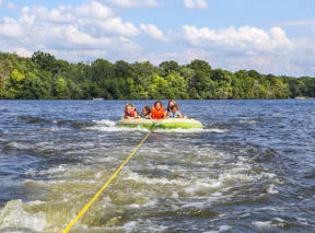 kids on an inflatable raft on a lake