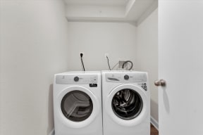 a washer and dryer in a laundry room  at Autumn Woods, Bladensburg, MD