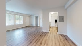 a bedroom with hardwood floors and white walls at Autumn Woods, Bladensburg, 20710