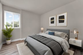 a bedroom with gray walls and a large window at Autumn Woods, Bladensburg, 20710