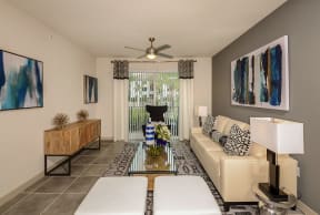Spacious living room with a ceiling fan at Azura in Kendall, FL