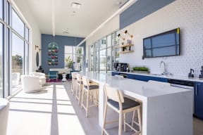 Expansive resident lounge overlooking the pool deck at The Chandler in North Hollywood