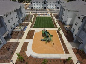 Playground and Green Area at The Retreat Affordable Apartments in Merced CA
