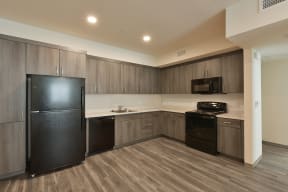 Kitchen with All Black Appliances at The Retreat Affordable Apartments in Merced CA