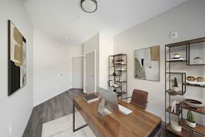 A room with a desk and a chair.