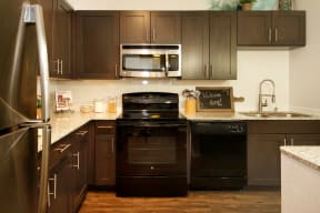 Kitchen with stainless steel and black appliances | Barcelona Jupiter