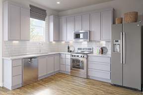 A modern kitchen with white cabinets and stainless steel appliances at Walker Place Apartments, Hewitt 76643