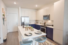 Chef-inspired kitchen with undermount sink, pull-down faucet, and plenty of pantry space | The Maven at Suwanee