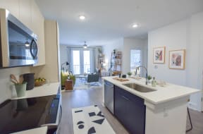 Kitchen with stainless steel appliances | The Maven at Suwanee