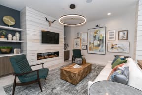 a living room with a fireplace and a tv on the wall