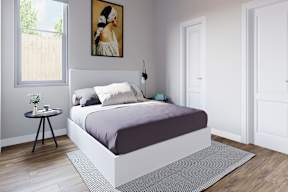 A bedroom with a bed, a small table, and a painting at Walker Place Apartments, Texas, 76643
