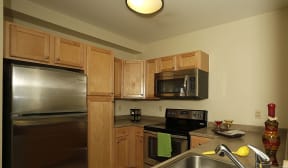 Kitchen appliances include range, refrigerator, dishwasher, and microwave |Residences at Manchester Place