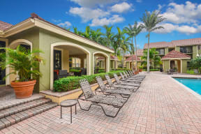 Pool deck with lounge chairs | Cypress Shores