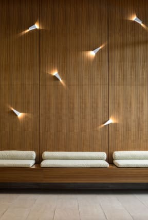 lounge area seating with lights on wall | The Merc building