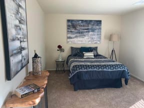 a bedroom with a bed and a nightstand
