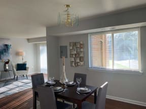 a dining room with a table and chairs