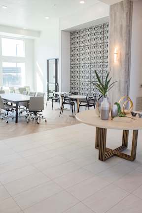 A room filled with furniture and a large window
