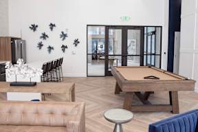 A living room with a pool table