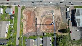 A construction site is visible in the middle of a residential area.