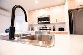 a kitchen with a sink and a counter top