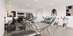 A man is working out on a treadmill in a gym.