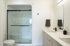a bathroom with a toilet sink and a shower