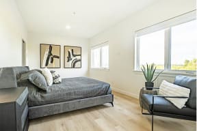 a living room with a couch and a bed