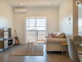 a living room with a couch and a window
