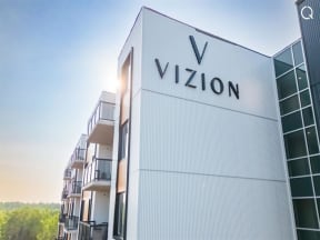 the facade of a building with the vixon logo on it