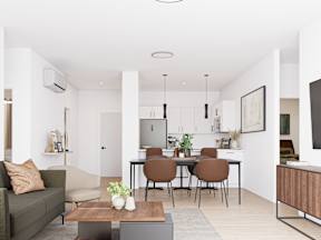 A modern living room with a dining table and chairs.