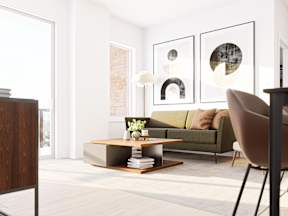 A modern living room with a green sofa and a coffee table.