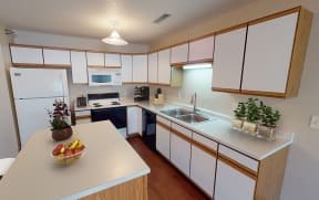 Kitchen with white paneled cabinets and central island