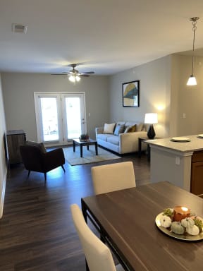 a view of a living room and dining room from the kitchen