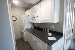 this is a photo of the kitchen in a 1 bedroom apartment at deer hill apartments in c