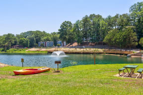 a park with a lake and a fountain