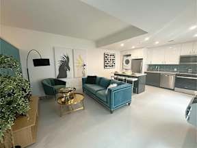 A modern living room with a blue couch and a coffee table.