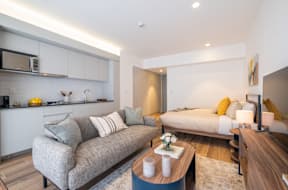 a living room with a couch and a table