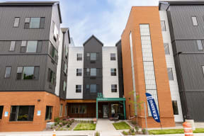 a group of new apartment buildings on a city street