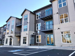our apartments are located on the corner of a city street