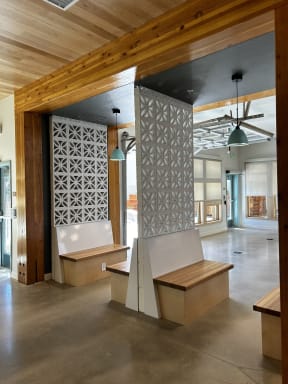 a view of the lobby of a building with benches