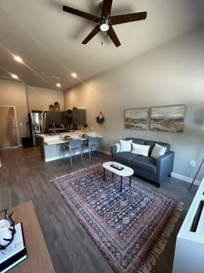 a view of the living room and kitchen from the dining room