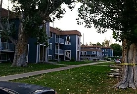 a row of houses with yellow tape in front of them