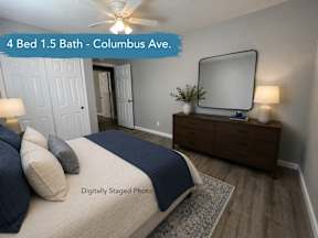 Staged bedroom with dresser and large mirror at OSM Properties Homes & Apartments, Chico