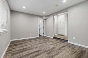 Empty bedroom with builtin closet and wood flooring at OSM Properties Homes & Apartments, Chico, CA 95926